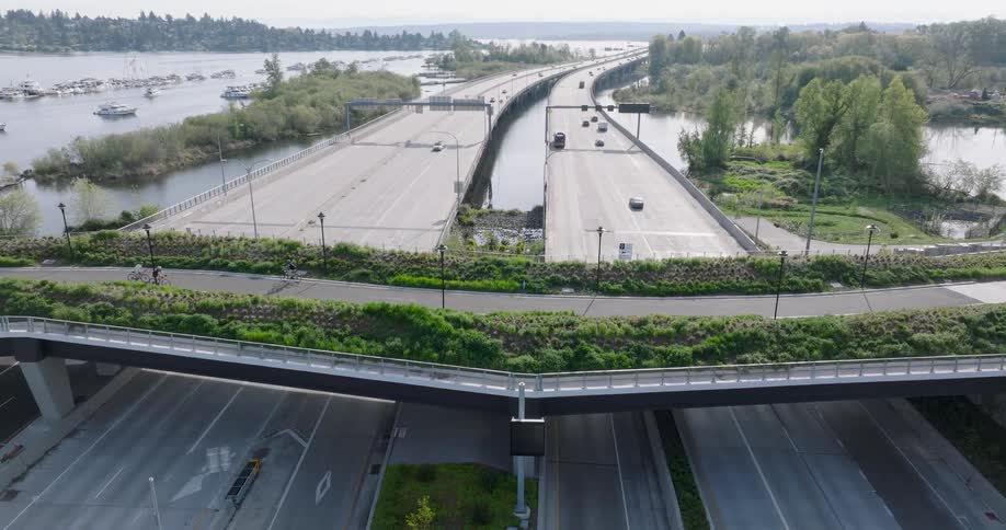 Subtle orbit around a bicycle and pedestrian path built over a highway interchange