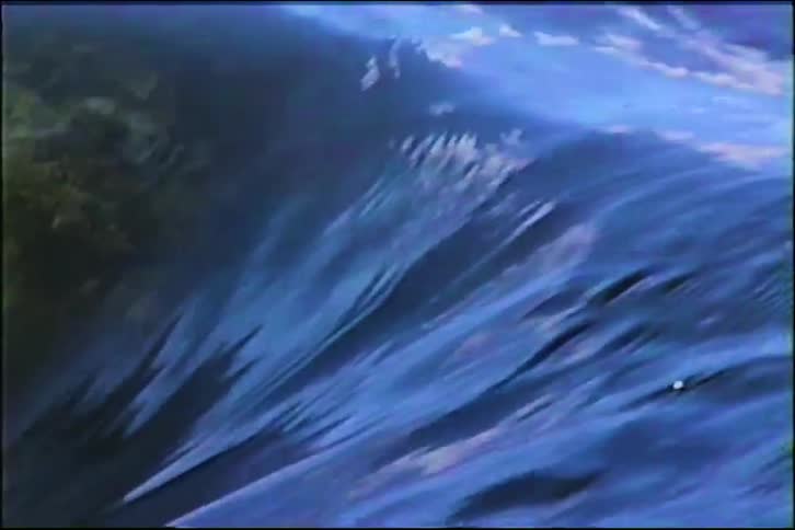An abstract close-up shot of rushing blue water creating beautiful and dynamic textures