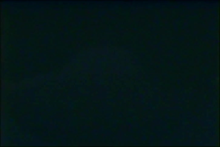 A vintage 1980s video features abstract flashing lights and close-ups of a traffic signal