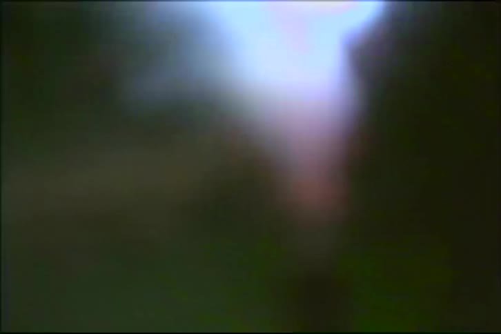 A vibrant and chaotic display of vintage fireworks exploding against the dark night sky