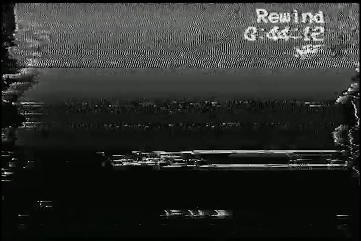 A compilation of authentic VHS tape rewind and tracking error glitch effects with colorful static and noise