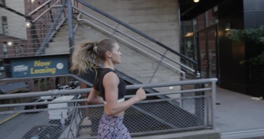 A woman jogs in a city