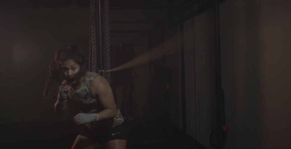 A woman is jumping back and forth under a rope