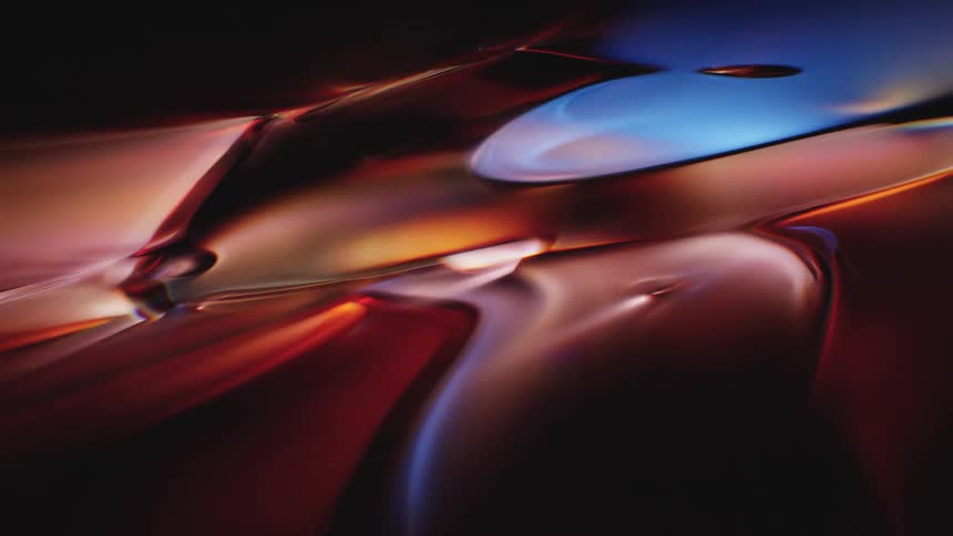 A moody and atmospheric close-up of slowly morphing liquid metal in vibrant red, orange, and blue hues