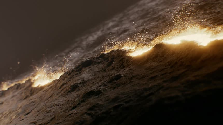 A line of fire with glowing embers slowly burns across a dark, textured surface in a cinematic close-up