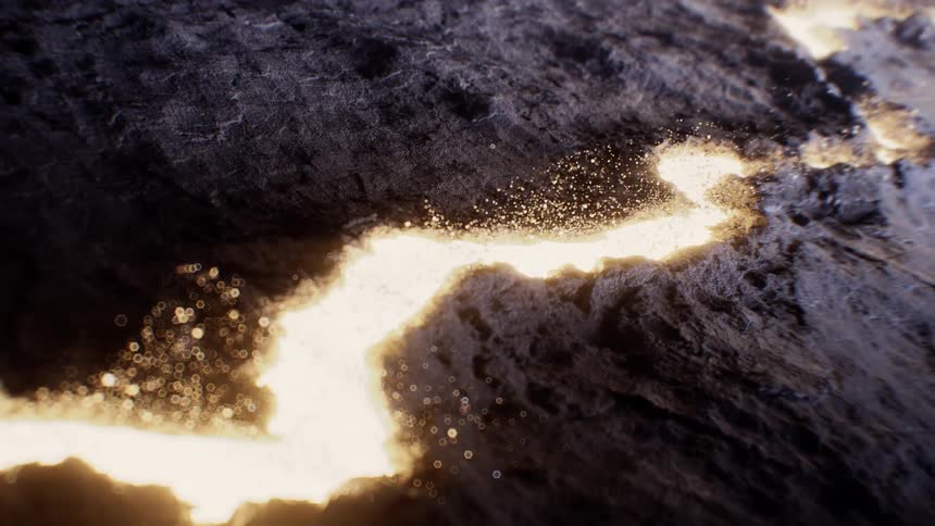 An abstract close-up shot of a glowing golden river flowing through a dark, rocky landscape with shimmering particles