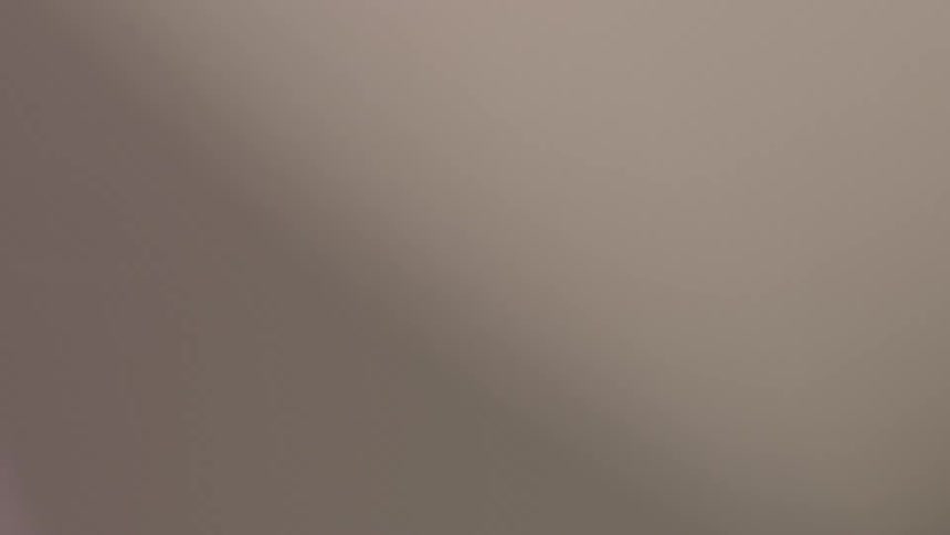 Dreamy and out of focus extreme close-up of a ceiling fan spinning
