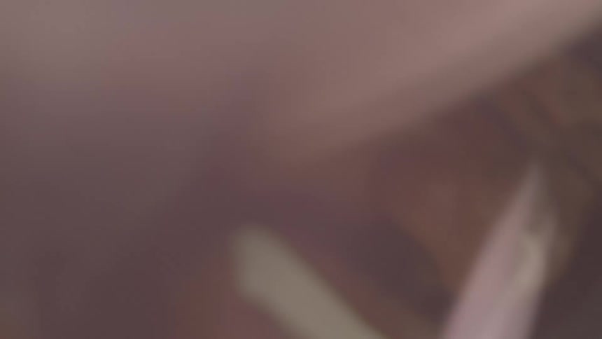 An abstract and blurry extreme close-up of a man's face, creating a mysterious and distorted visual effect