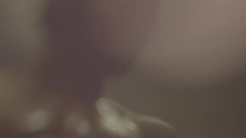 Close-up of a boxer with headgear on, training hard in a smoky and hazy environment
