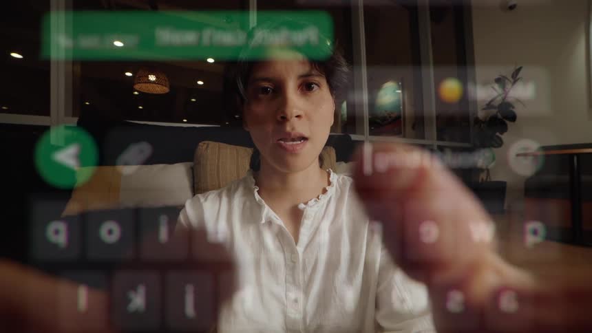 Creative POV of a woman's face seen through a transparent smartphone screen while she types a text message