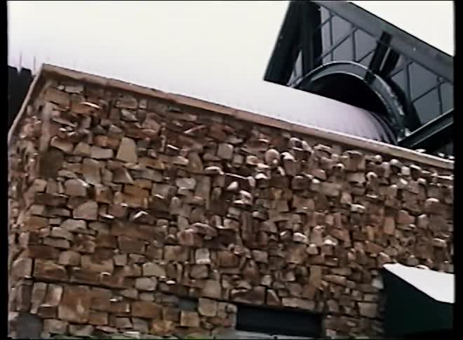 Vintage footage shows a gondola arriving at a snowy station in the ski resort town of Telluride, Colorado