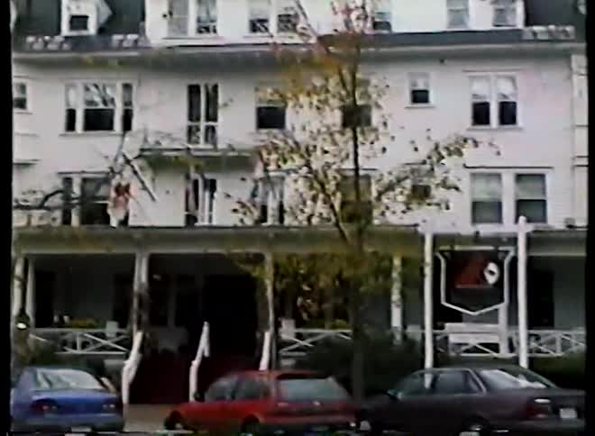 A slow pan reveals the historic Red Lion Inn and other colonial-style buildings on the main street of a quaint American town