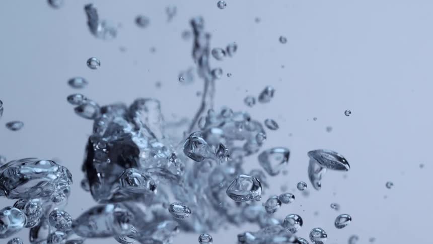 Mesmerizing slow motion macro shot of clean air bubbles rising in pure water