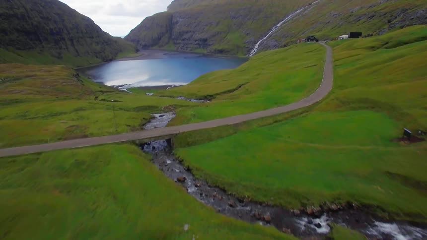 Aerial view of a small lake close to mountains