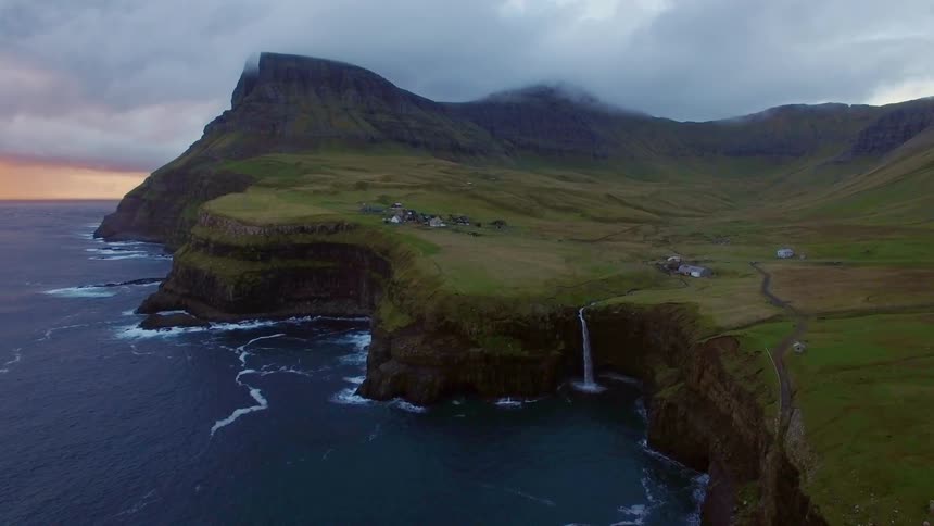 A sheer cliff near a large body of water