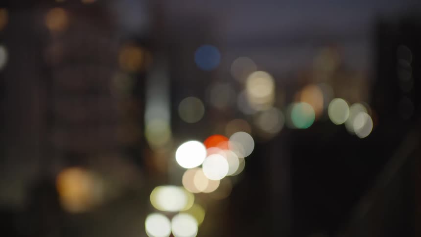 Abstract bokeh of city lights and traffic at twilight