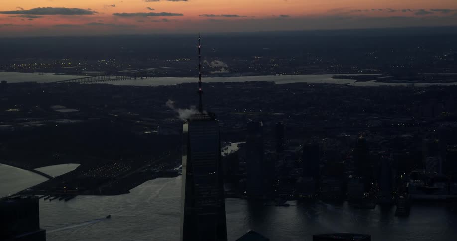 View of a skyscraper top at sunset