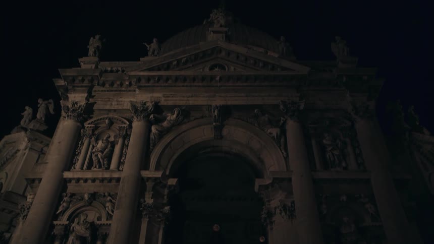 The columns and carvings around the doorway of a building