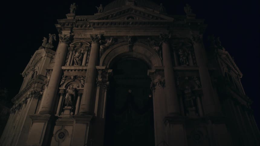 An old pillared building at night