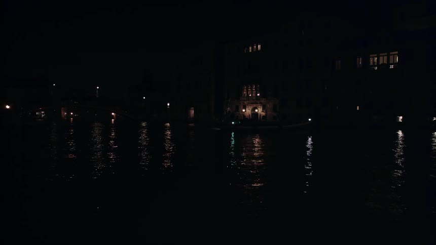 Vehicles pass the road in the city at night