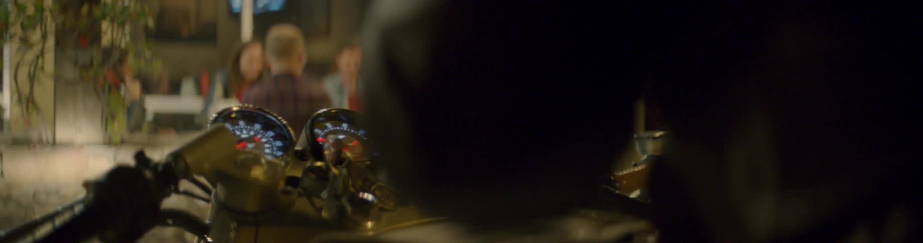 A man adjusts the dials on his motorcycle