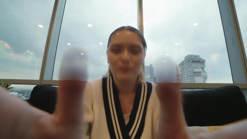 First-person perspective of a young woman giving a relaxing shoulder massage in a modern office