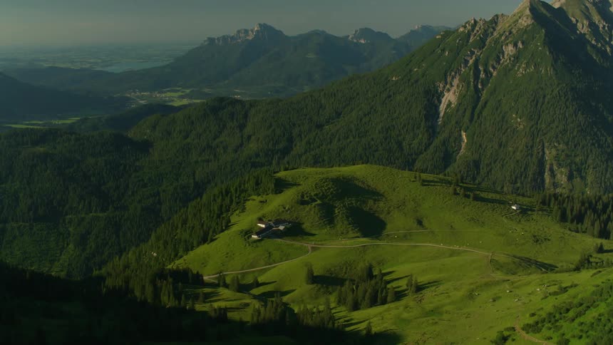 The mountains are high and covered with green