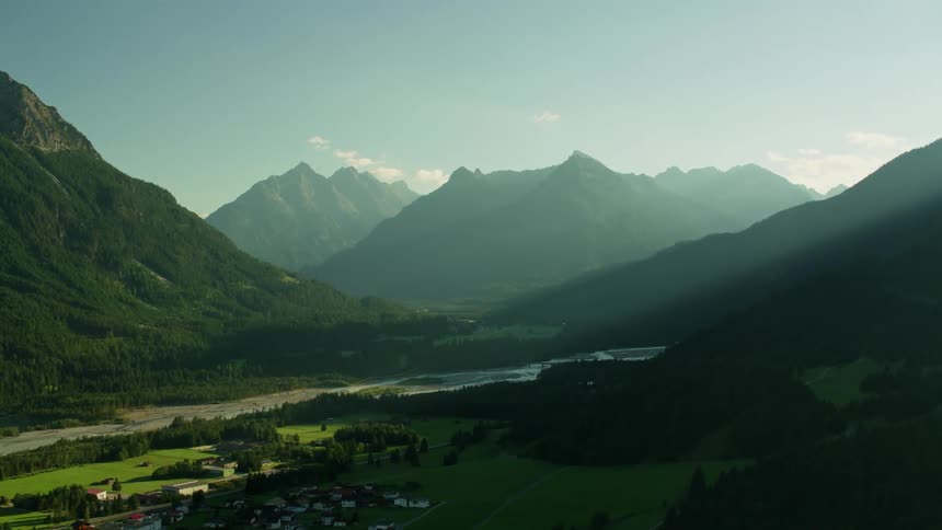 Aerial view of a small town in a valley between mountains