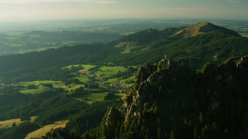 A village sits nestled in a mountain valley