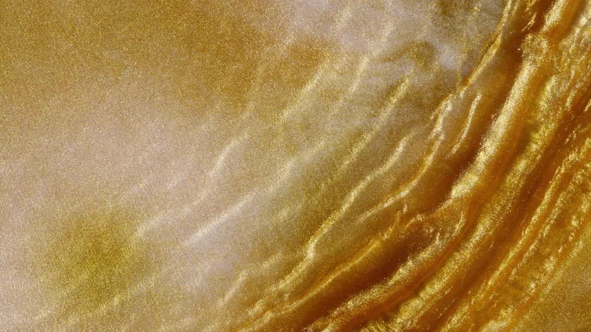 A mesmerizing flow of shimmering golden liquid creates an abstract and luxurious background texture