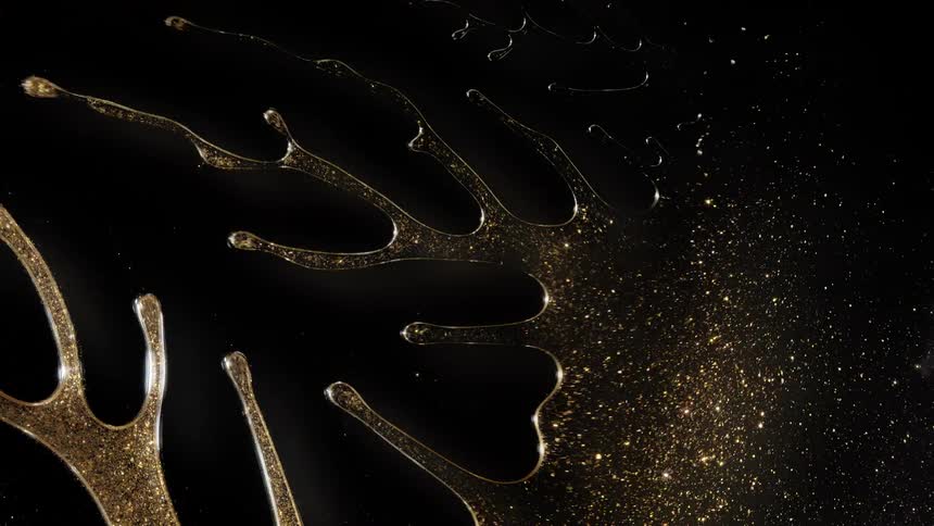Abstract macro shot of shimmering gold liquid with sparkles spreading slowly across a black background