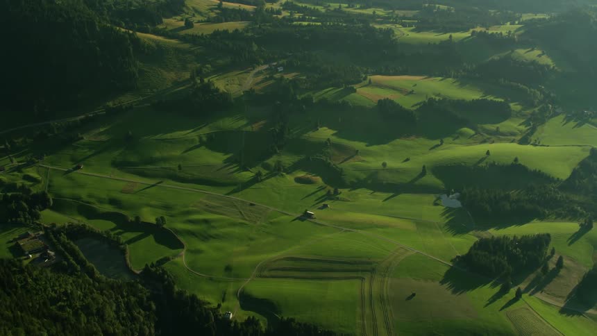 The field below is vast and green