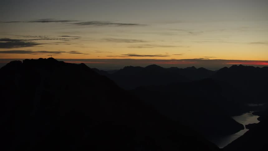 Rolling mountains at sunset on a partly cloudy day