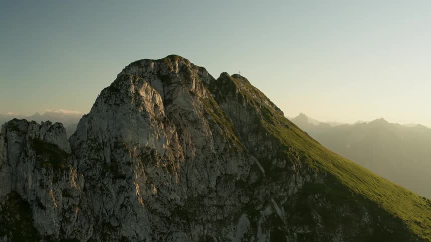 The mountain is high and covered with green