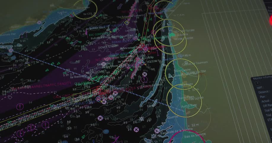 A modern ship's electronic chart display system (ECDIS) zooms from a global view to the detailed, busy shipping lanes of the English Channel