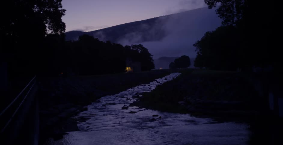 A river through a foggy valley