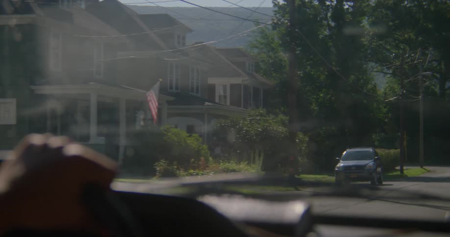 Person driving down a city street