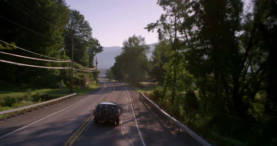 A car is traveling around a winding road