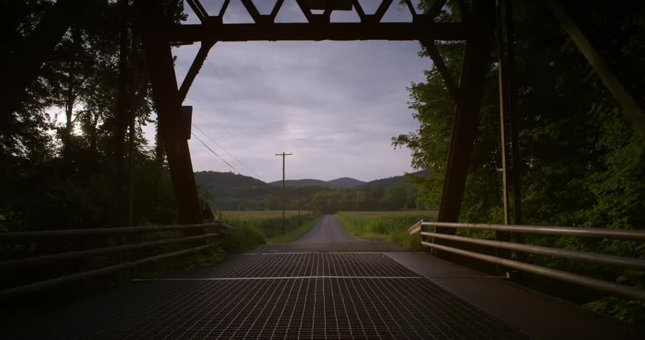A bridge leading to a road in the country