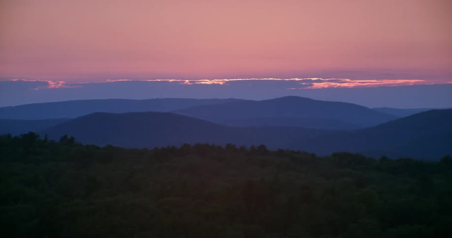 The vast length of valleys are dark at dawn