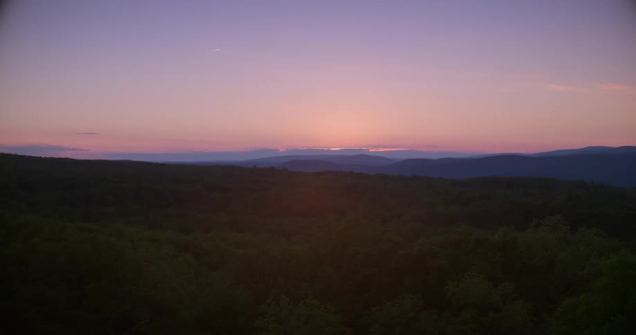 The long field is hilly at dawn