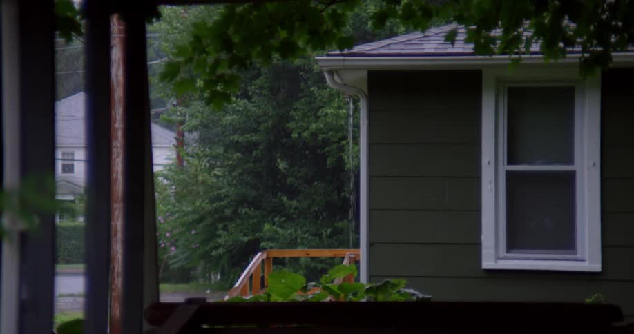 The rain pours down the gutters of this home