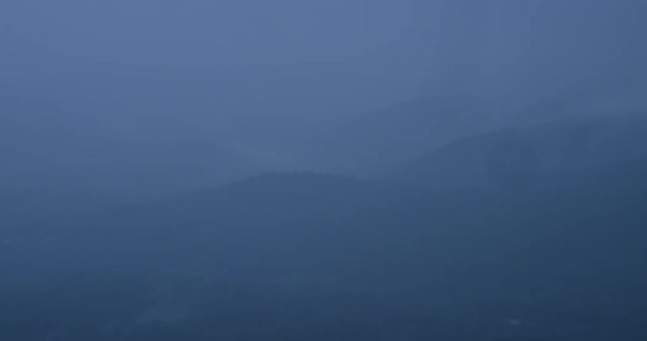 There is heavy fog over the mountains