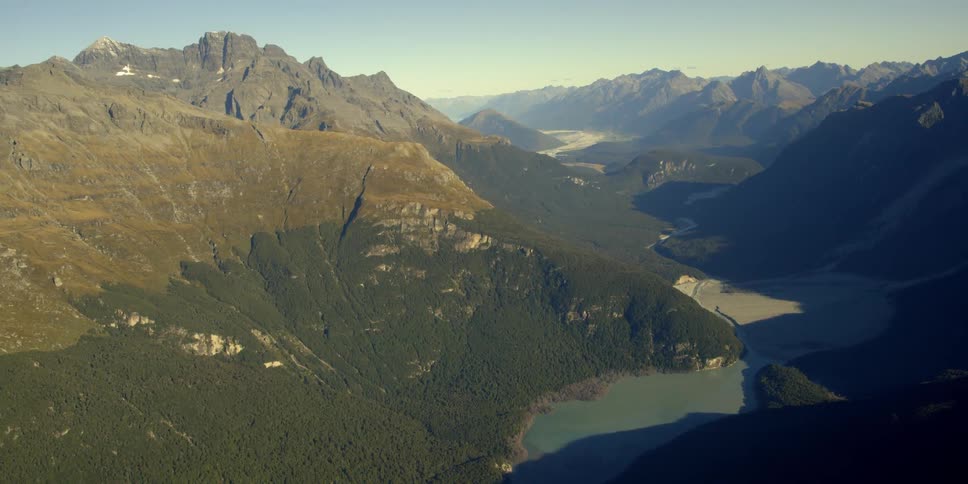 The vast mountain range has water down at the bottom
