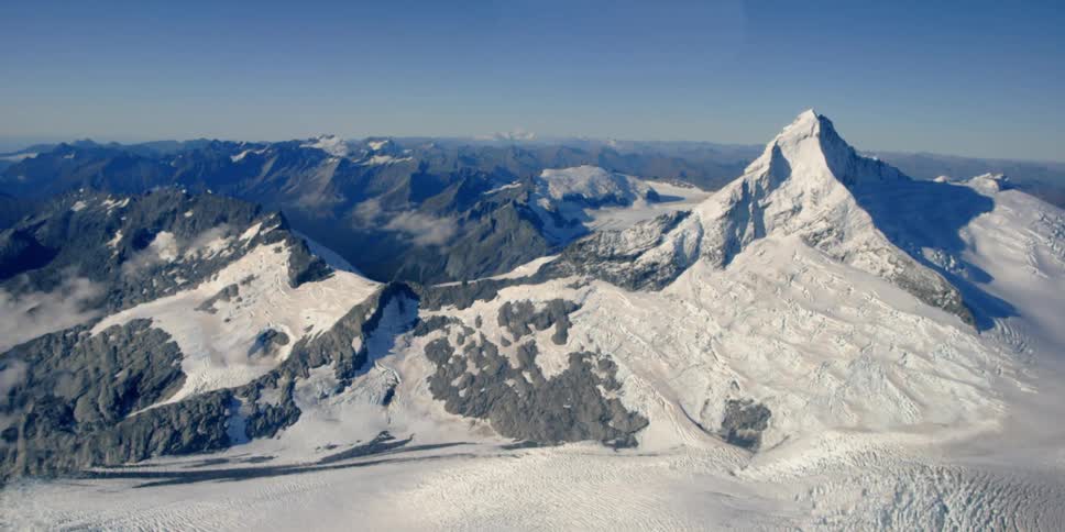 Snow covered mountains during the day