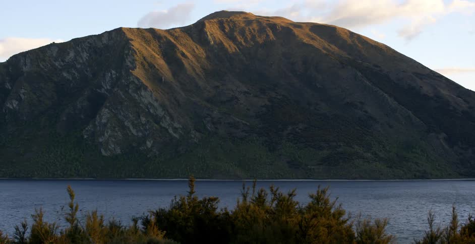 A body of water at the base of a mountain