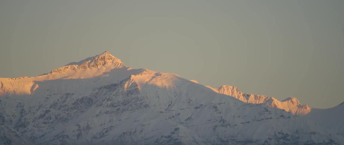 The mountain is covered with snow and ice