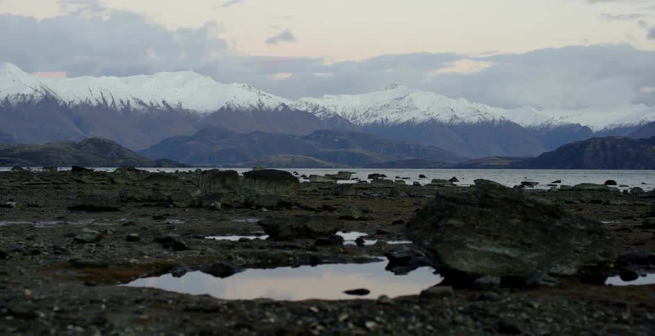 The rocks before the mountain have water and ice