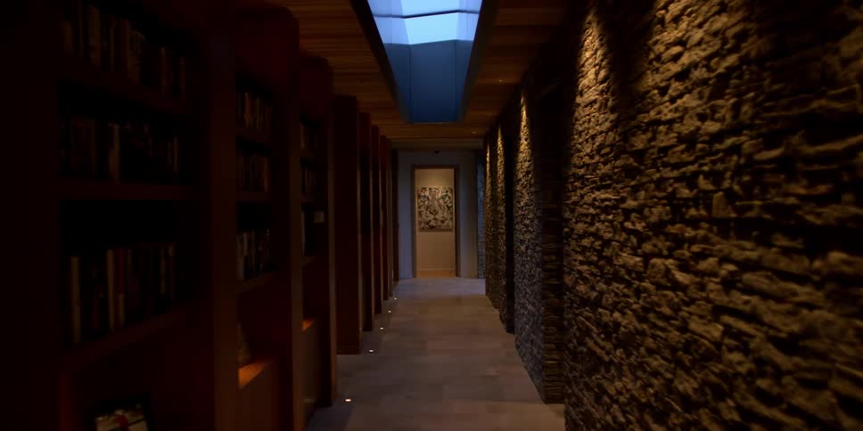 A dim hallway is shown