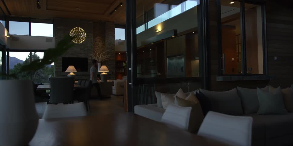 A man walks through his living room